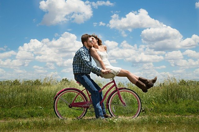 A couple on a bicycle