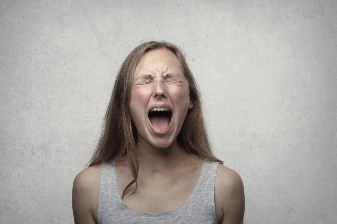 A woman screaming in anger