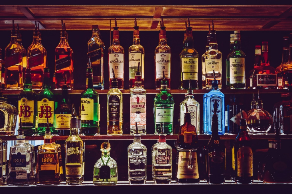 A bar with various alcohol bottles.