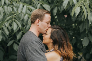 A person kissing the forehead of a person they love