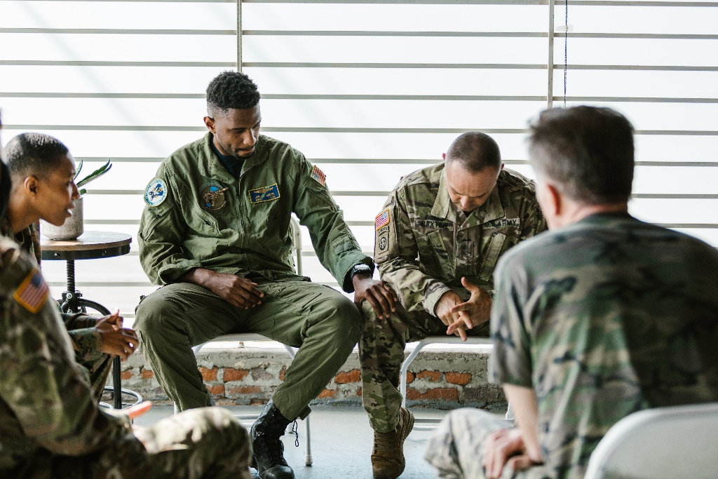 Service members sitting together